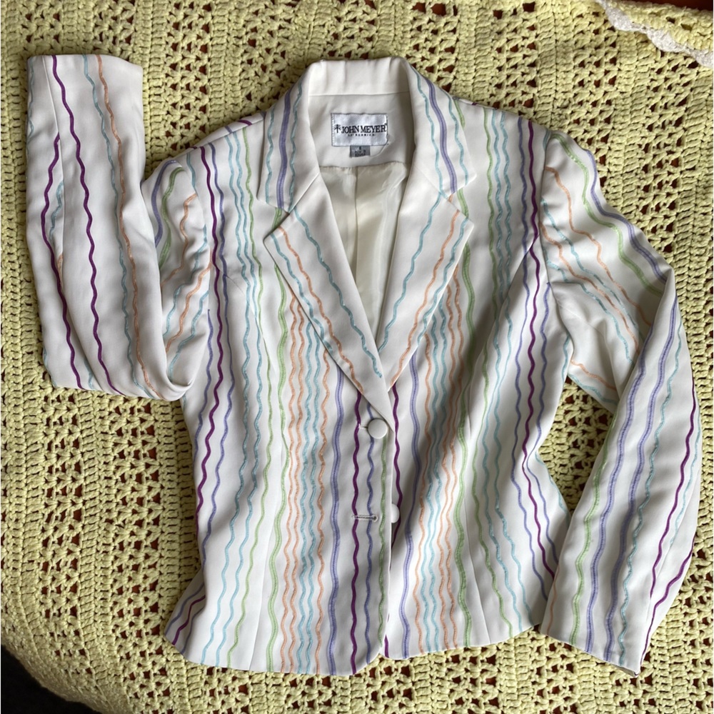 White womans blazer with sewn, squiggle design